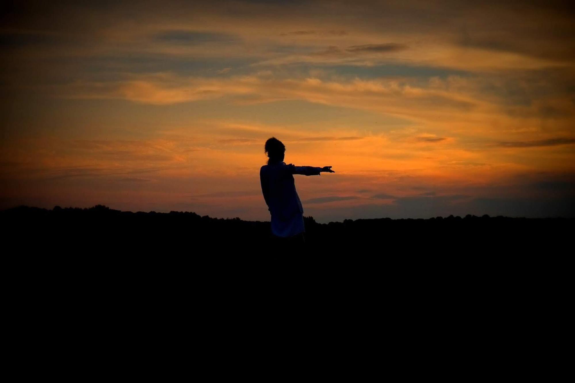 Silhouette against sunset sky — Beyond Movement