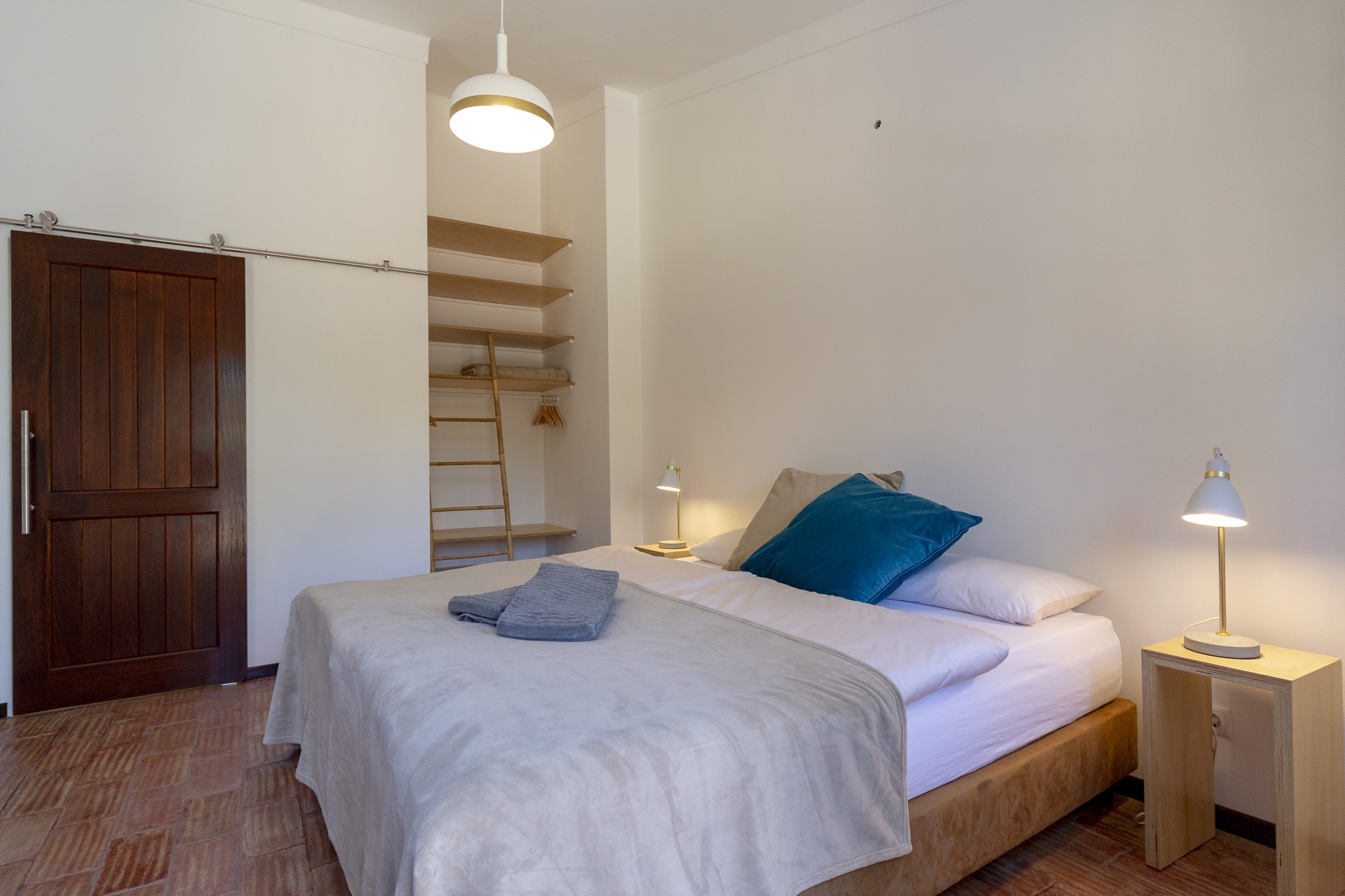 Individually styled guest room with terracotta floors